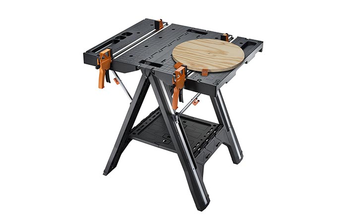 WORX Pegasus Folding Work Table with a circular piece of wood on it