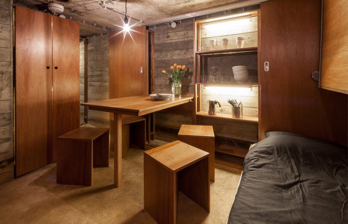 a main room in the bunker with a dining table