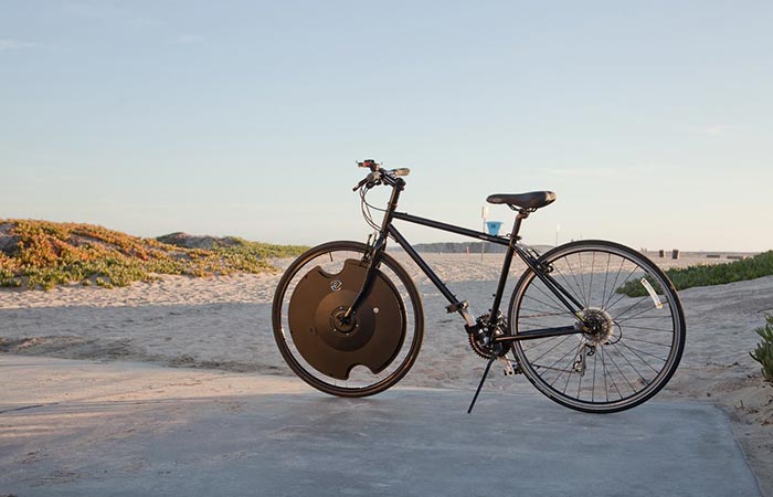 Bicycle with Electron Wheel on the beach