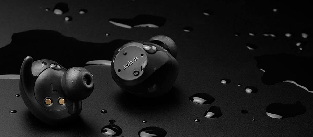 Jabra Elite Sport with a black background and water droplets