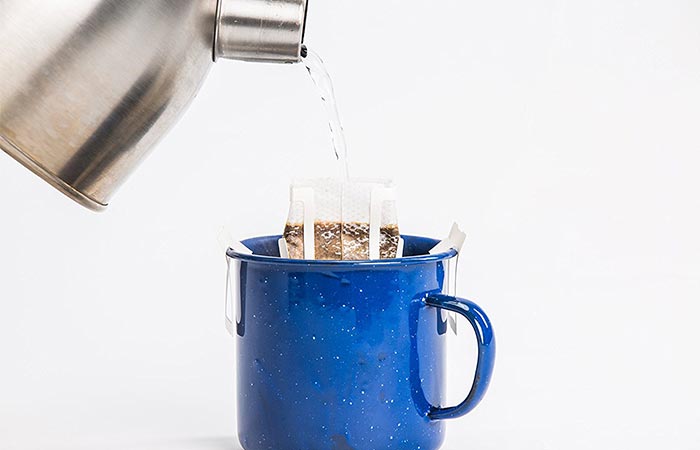Water being poured into a Libra Pourtable coffee bag.