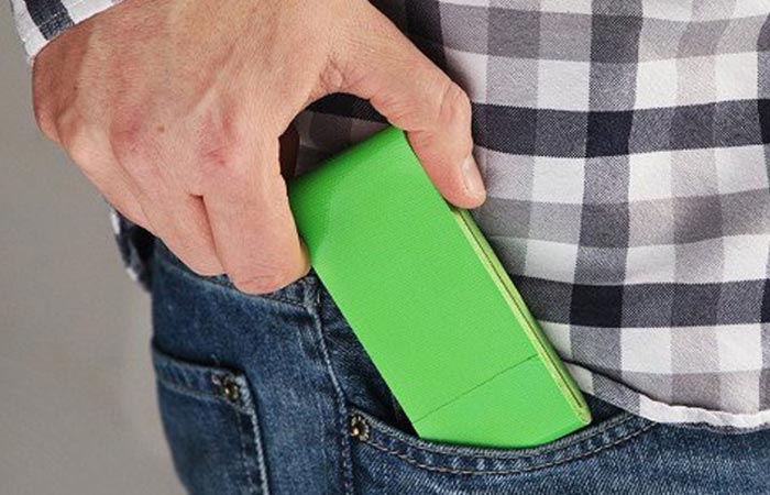 placing a green duct tape in a pocket