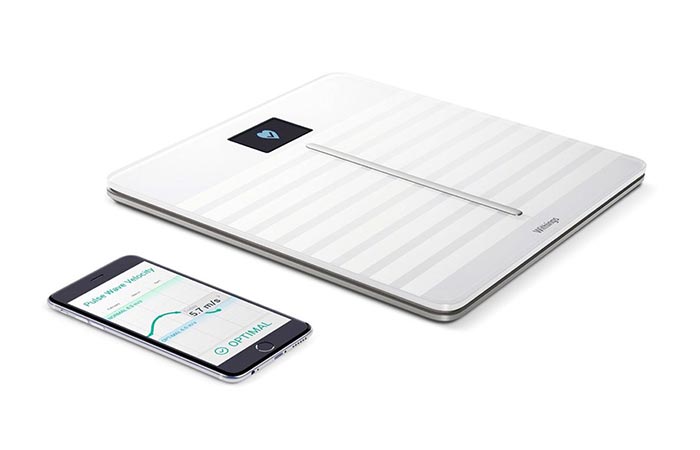 Withings scale next to a phone