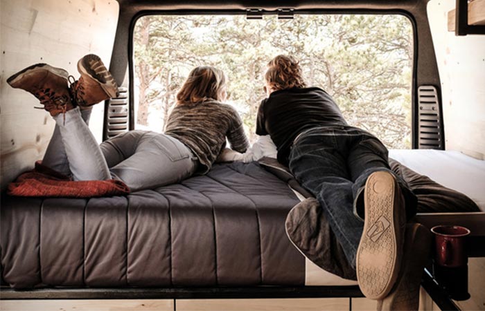 two people in a van looking out the window