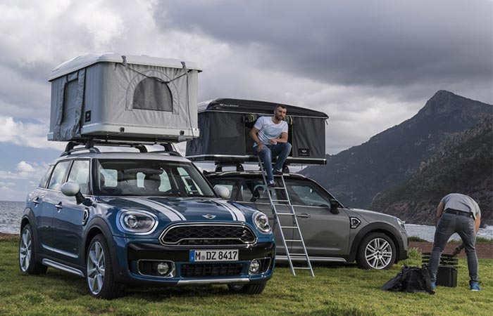 two cars with rooftop tents